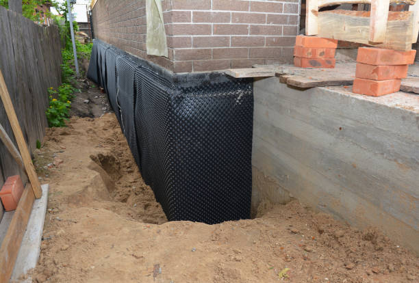 Happy homeowners after waterproofing job in Keuka Park